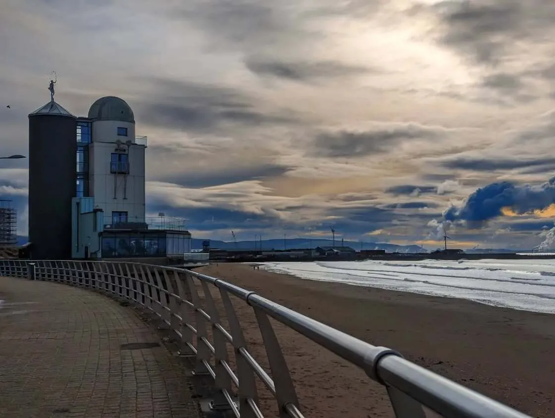 The Observatory tower on the seafront with the beach beside it